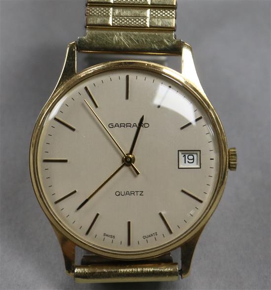 A gentlemans 9ct gold Garrard Quartz wristwatch with date aperture
